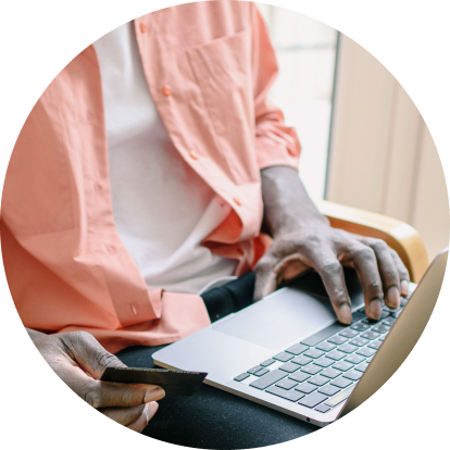 Person paying on a laptop