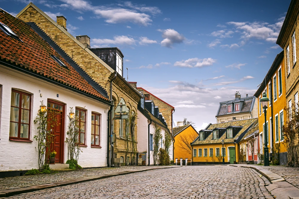 Houses on a cobbled street in Lund, Sweden. BNPL is most popular in Sweden and Germany