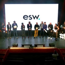 The ESW Team stands on a stage accepting the nuit-du-commerce-connecte award