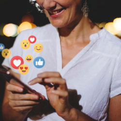 a closeup of a woman on social media with like and love emojis superimposed to show engagement