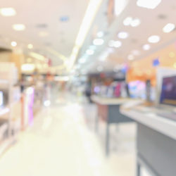 blurred view of consumer electronics in a retail store