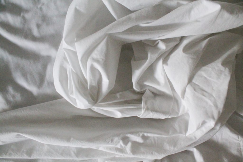 a white rolled up bedsheet