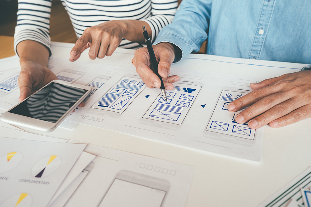 two people designing the wireframes for ecommerce checkout pages