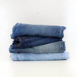 a stack of folded denim jeans