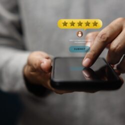 A closeup of a person leaving an online product review via a cell phone